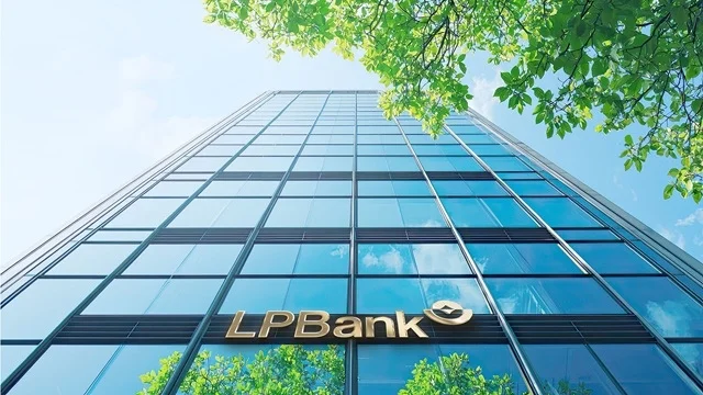 LPBank headquarters viewed from below with the bank logo on the glass building